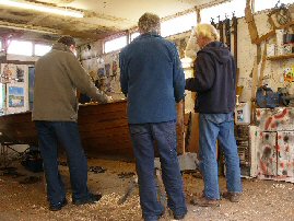 Rob Holroyd, Keith Callaghan and Laurie Smart discuss Rob's new Merlin.(The boat shown is Steven Pollitt's Proctor MkXII, NOT the new Merlin!)